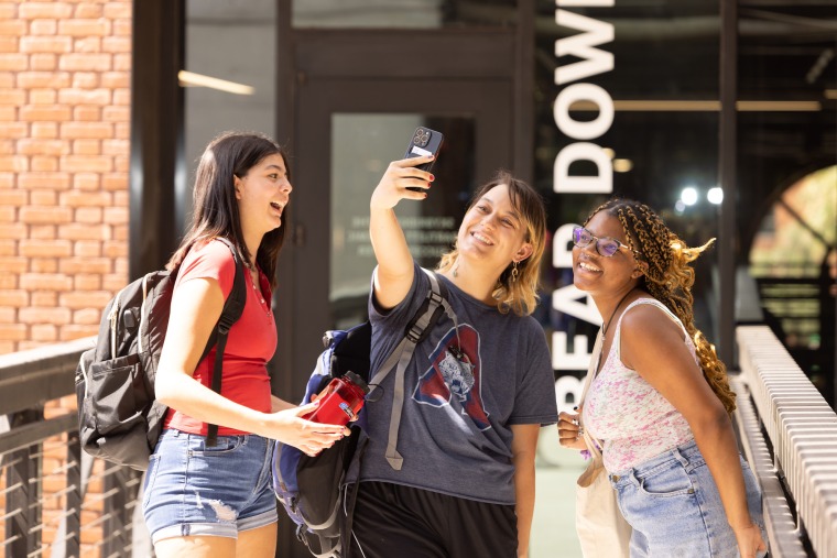 Students taking a selfie on UArizona campus