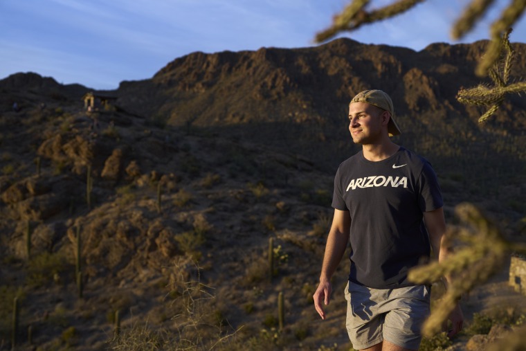 Male student hiking in Tucson