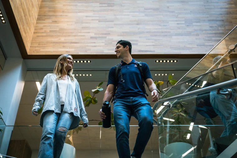 Two law students walking down the stairs