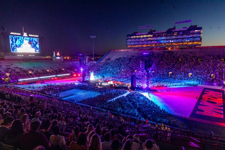 Commencement lighting in UArizona football stadium at night