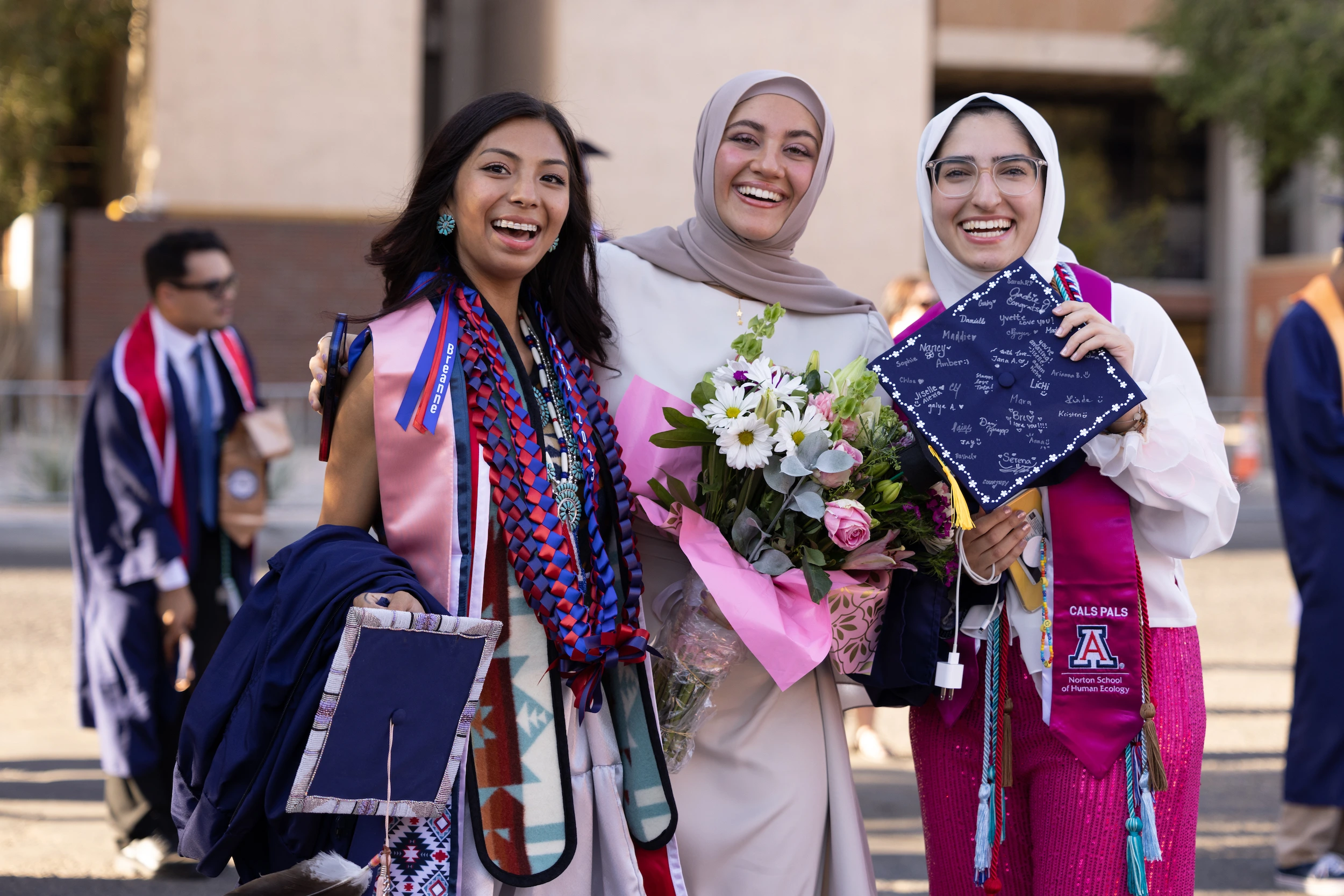 Three students at UArizona commencement