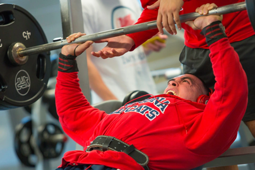 Student weightlifting at the gym