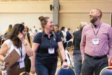 ONE conference attendees laughing